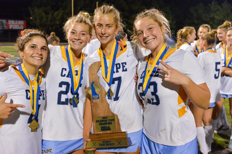 Captains with the 2024 field hockey state championship trophy are (l-r) Avary Miller, Atia Sabbagh, Macy Steinwedel and Lina Frederick. DAVE FREDERICK PHOTOS